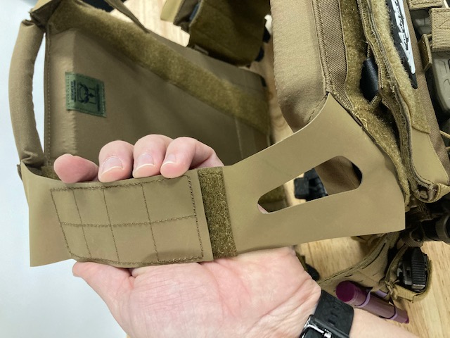 Attaching shoulder strap to velcro on the Invictus carrier from Armored Republic